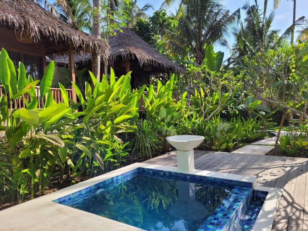 Plunge pool with bungalows in the background
